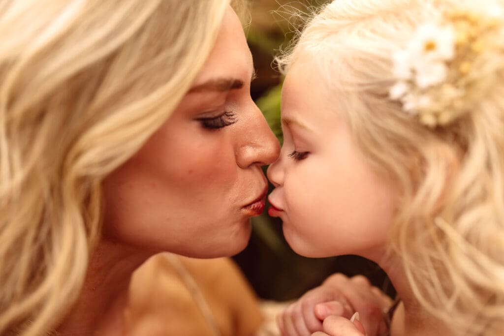 Mother and daughter sharing a quiet moment during an indoor family session near Kansas City, Missouri