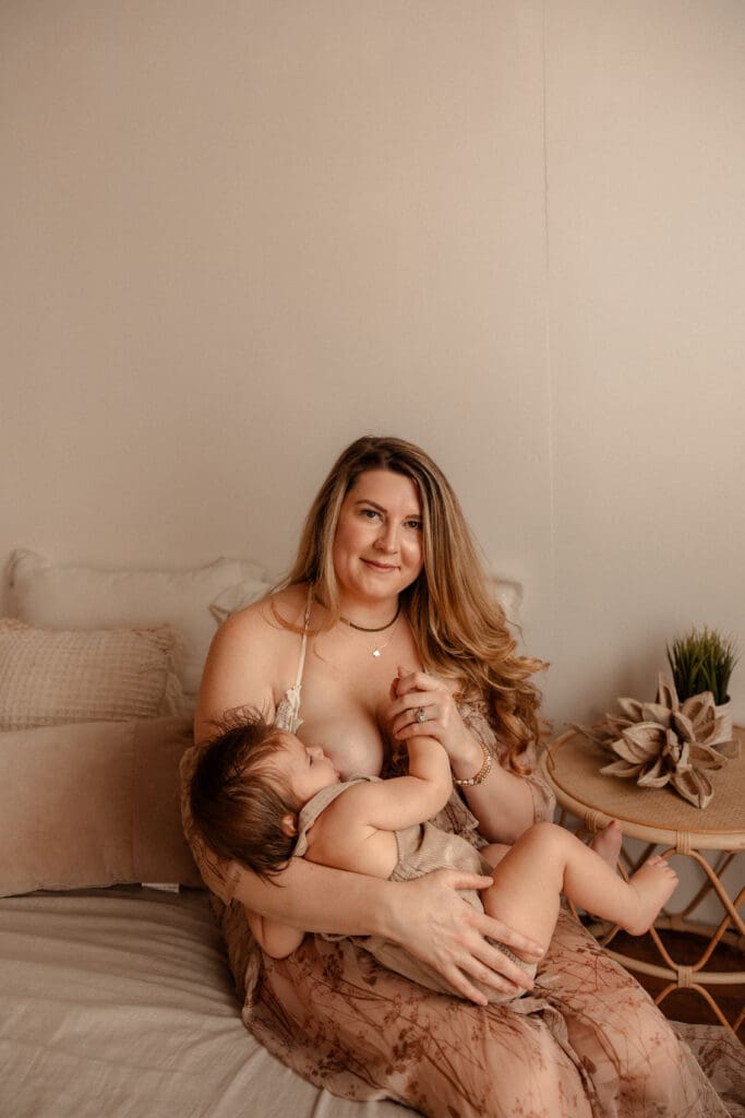 Maternity portraits in Kansas City indoor studio with soft window light and neutral styling