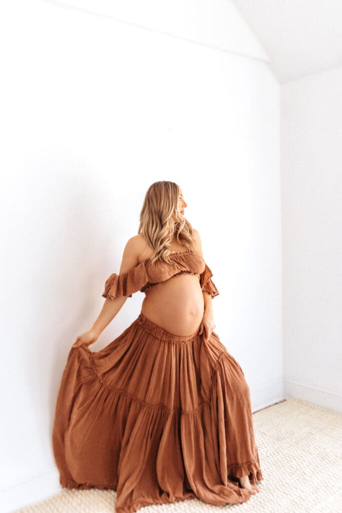 Timeless studio maternity photos featuring flowing neutral two-piece dress in Kansas City Missouri