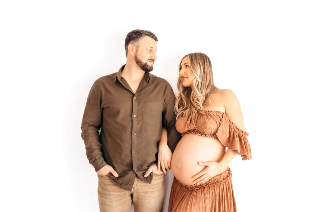 Soft studio maternity portrait created in a Kansas City photography studio using natural light