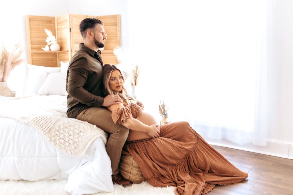 Couples maternity photography session with neutral styling designed to feel calm and timeless in Kansas City