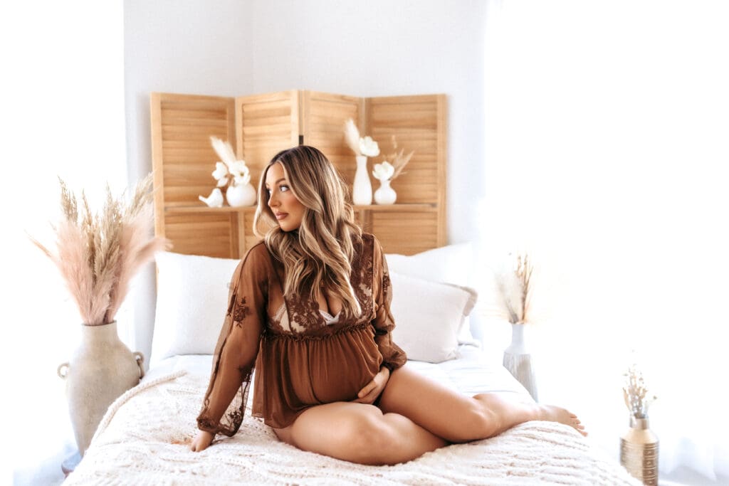 Studio maternity photography showcasing a intimate outfit with neutral warm brown in Kansas City