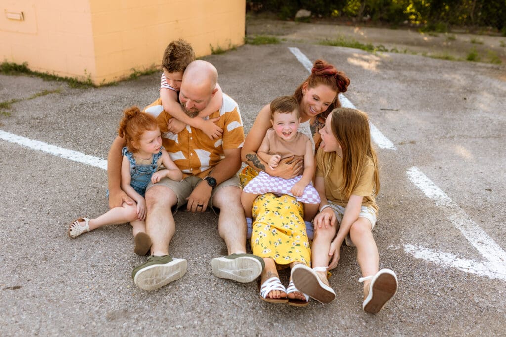 Close up of coordinated family outfits with bold colors styled for an urban Kansas City photoshoot