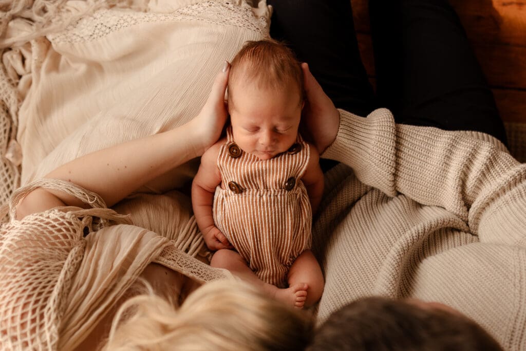 Close up image of a newborn in a studio family session near Smithville Missouri