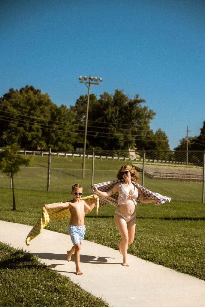 Mom and son racing around the Liberty City Park near Kansas City Missouri